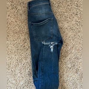 High rise skinny jeans with holes.